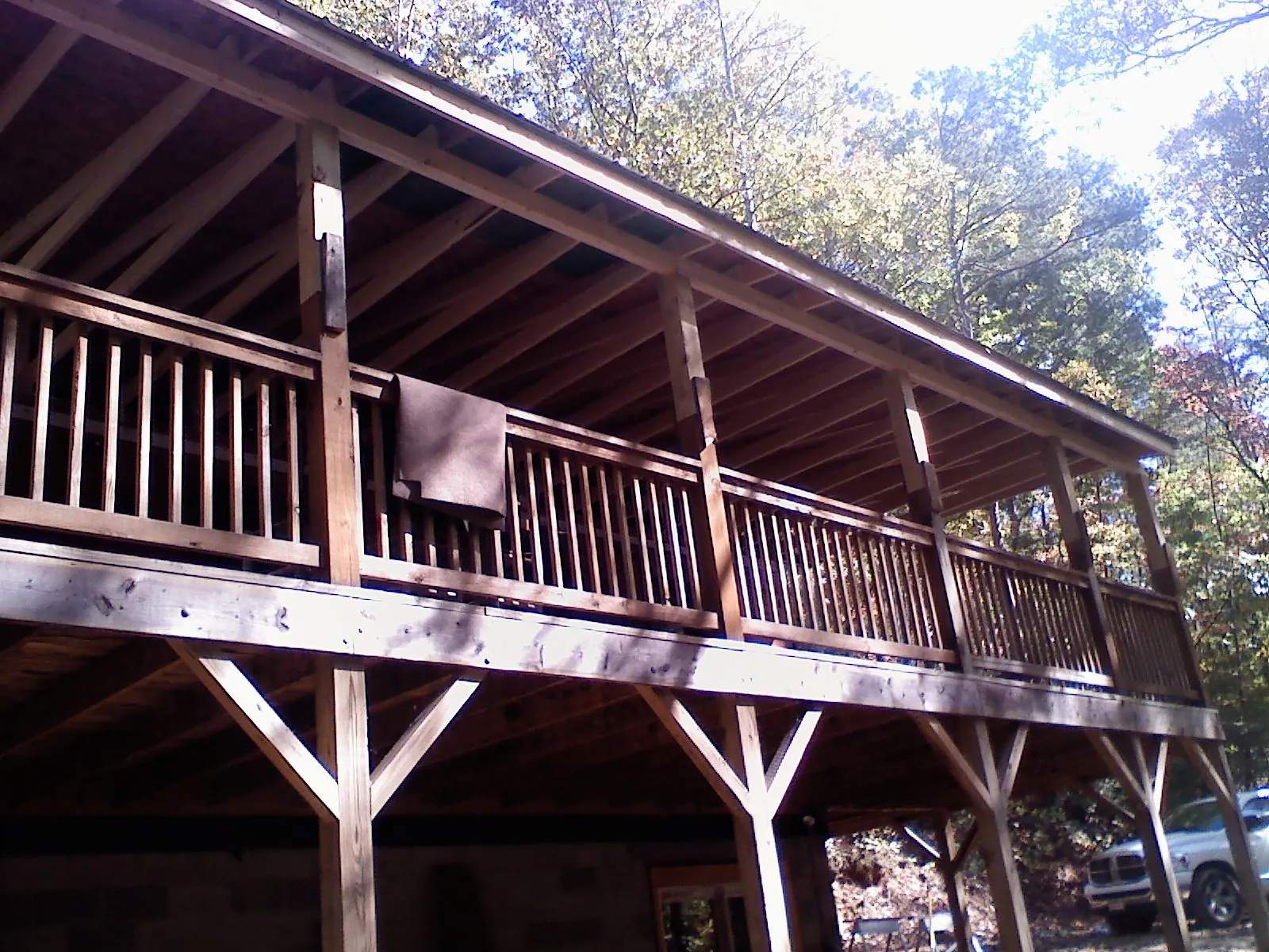 Timber framing under a new elevated porch and deck — Roof Leak Repair in North Troy by Roofing Brothers